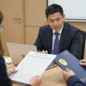freepik__university-directors-men-and-women-reviewing-regul__46650